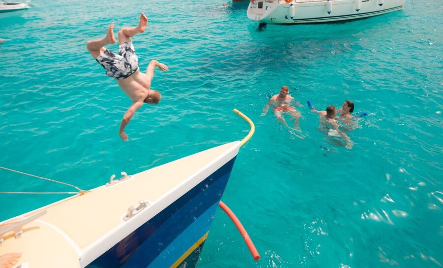 Comino: Blue Lagoon Catamaran Cruise with Lunch and Open Bar - After lunch party mode: music, dancing, and where to get quiet