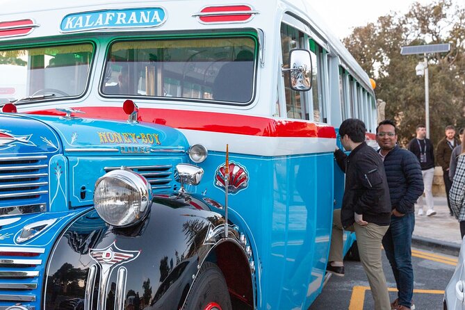 Explore Valletta, Sliema, St. Julian's & Mdina on a Vintage Bus - Entering Valletta: Tourist Information Office and the Triton Fountain Stop