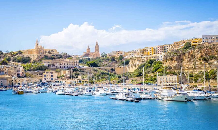 From Malta: Gozo Tuk-Tuk Tour with Comino Mini Cruise - Dwejra Bay and Inland Sea, plus Ta’ Pinu in the background