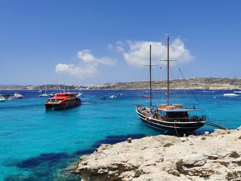 From Sliema or Bugibba: Comino Blue Lagoon Round Trip Ferry - On Board Comfort: Air-Conditioned Catamaran, Free WiFi, and Real Restrooms