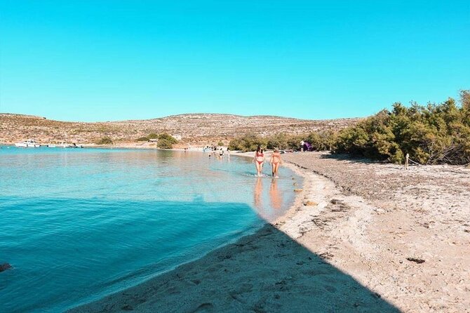 Half Day Malta Tour to Gozo Comino and Blue Lagoon Caves - Gozo Harbour and the San Niklaw Bay glide-by: the scenery breaks up the swim day