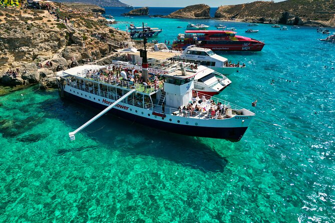 Malta: Comino, Blue Lagoon & Caves - swim, snorkel & slide - Bugibba Jetty, captain Kevin, and the rooftop chair move