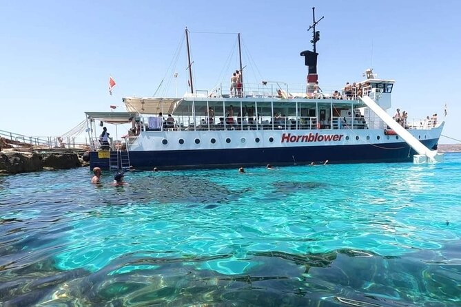 Malta: Comino, Gozo, Blue Lagoon, Crystal Lagoon and Caves Tour - Comino’s Blue Lagoon stop: swim, snorkel, slide, and landing pass basics