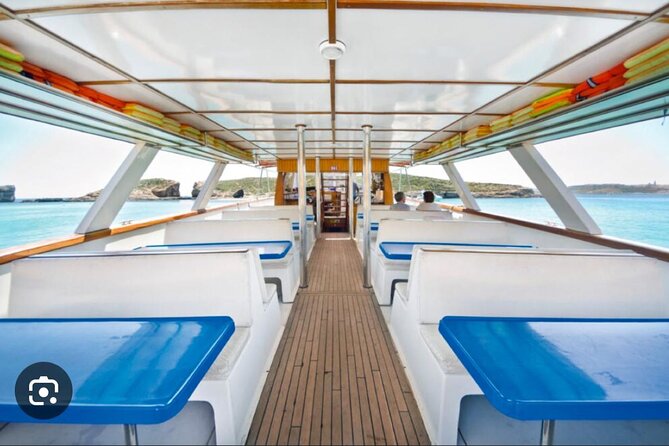Malta: Gozo, Comino, Blue lagoon Tour with Cave Trips - The Boat Experience: Slide, Shower, Deck Chairs, and Basic Comfort