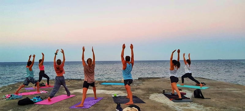 Sliema: Beach Yoga Class - Sliema Sunrise or Sunset Yoga at the Waterline