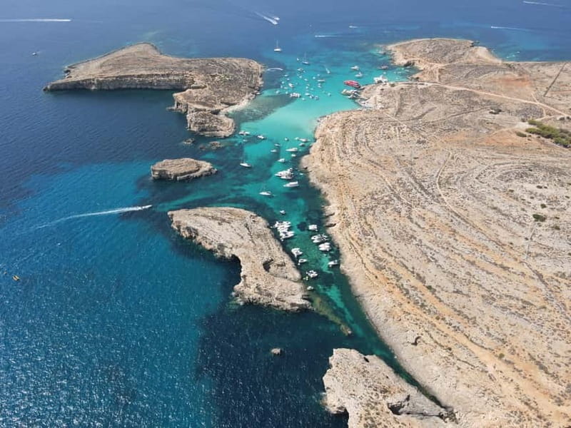 Sliema: Cruise to Comino, Crystal Lagoon, and Blue Lagoon - The boat experience: waterslide, bar, and how the day feels onboard
